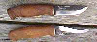 Click here for an enlarged image of the knife
and it's sheath.