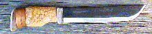 Click here for an enlarged image of the knife
and it's sheath.